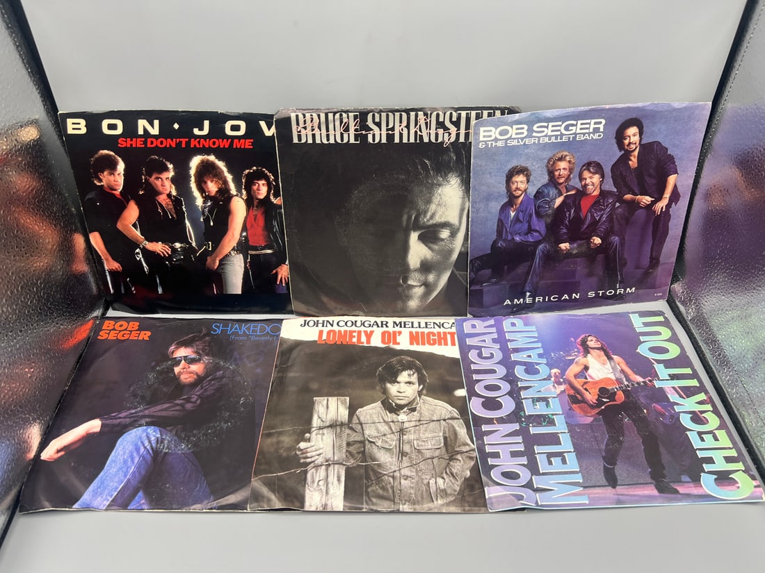 Lot of six (6) 7-inch 45rpm records with picture sleeves - Bon Jovi: She Don't Know Me (1984); Bruce (1 of 4)