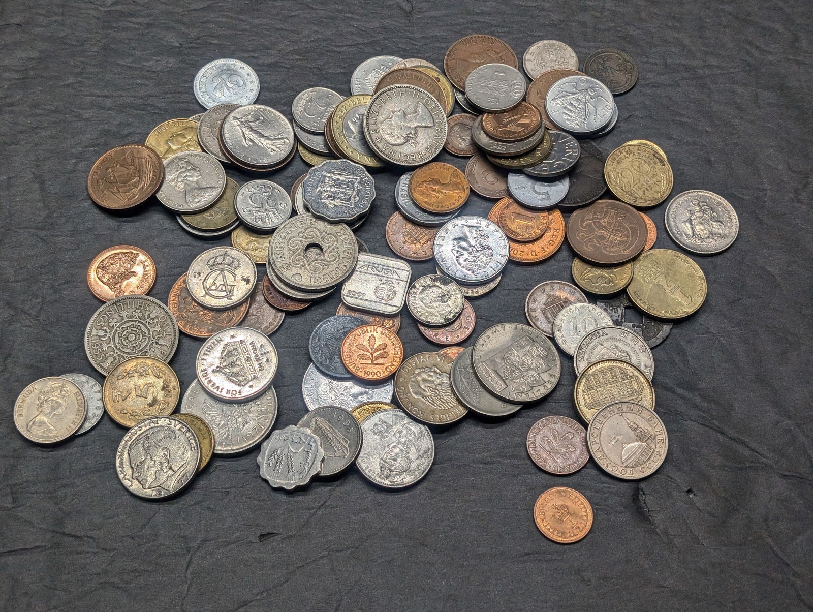 One pound plus of unsearched foreign coins. Nice older mix. (1 of 4)