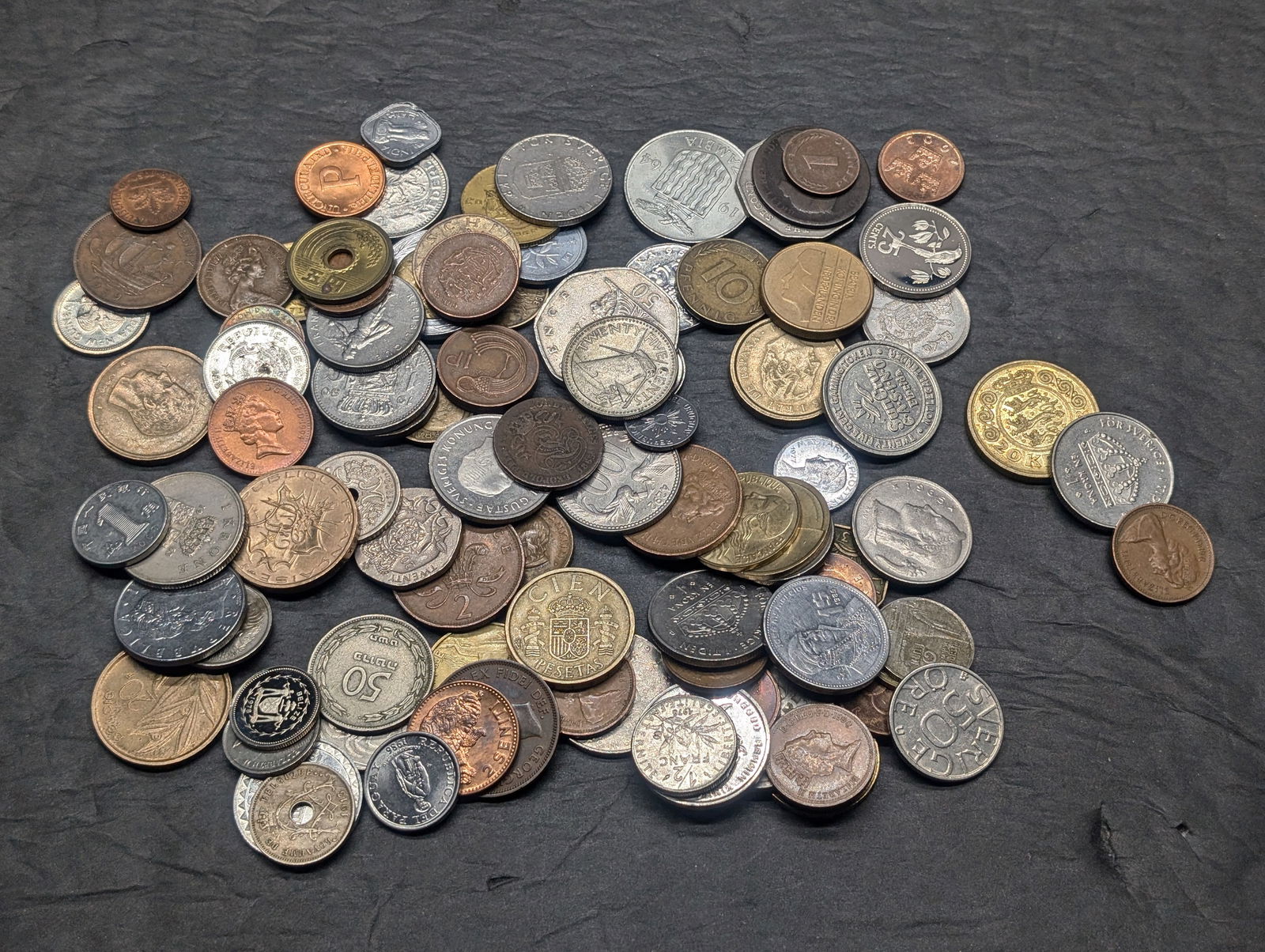 One pound plus of unsearched foreign coins. Nice older mix. (1 of 4)