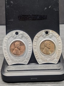 Two encased Lincoln Cents: 1947 Welfare Finance and 1948 Colonial Finance.