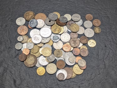 One pound plus of unsearched foreign coins. Nice older mix.