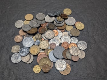 One pound plus of unsearched foreign coins. Nice older mix.