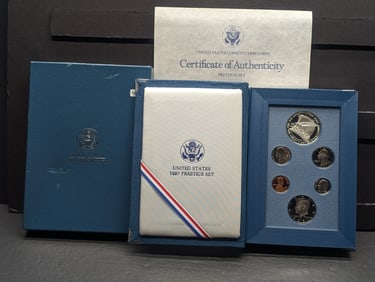 1987-S US Prestige Proof Set. Regular coins plus a Constitution Commemorative Silver Dollar. GEM in
