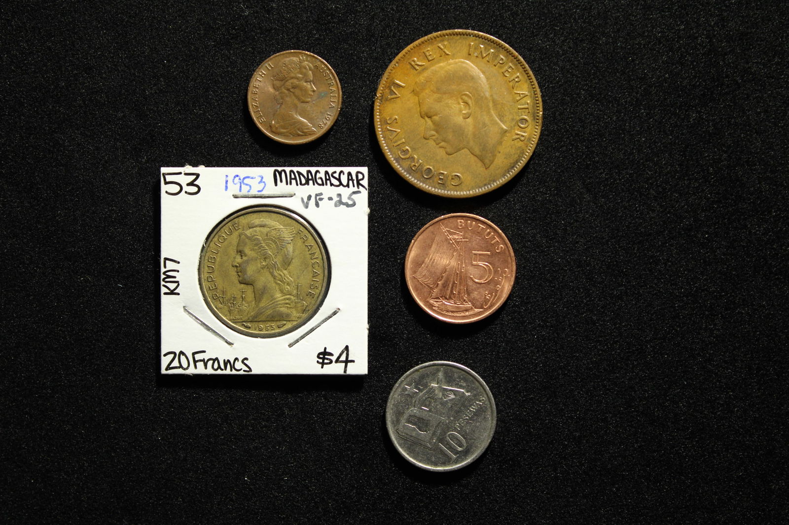 5 World Coins (1953 Madagascar-20  Francs, 2007 Ghana-20 Pesewas, 1998 Gambia-5 Bututs, UNC, 1942 S. (1 of 2)