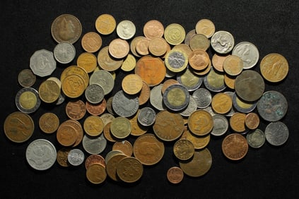 One pound plus foreign coins. Nice mix.