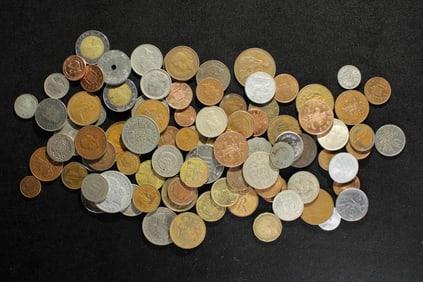 One pound plus foreign coins. Nice mix.