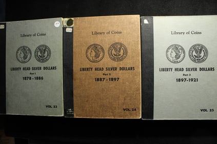 3 Volume Set of Library of Coins slide albums for the Morgan $1 Set. Definitely used but the
