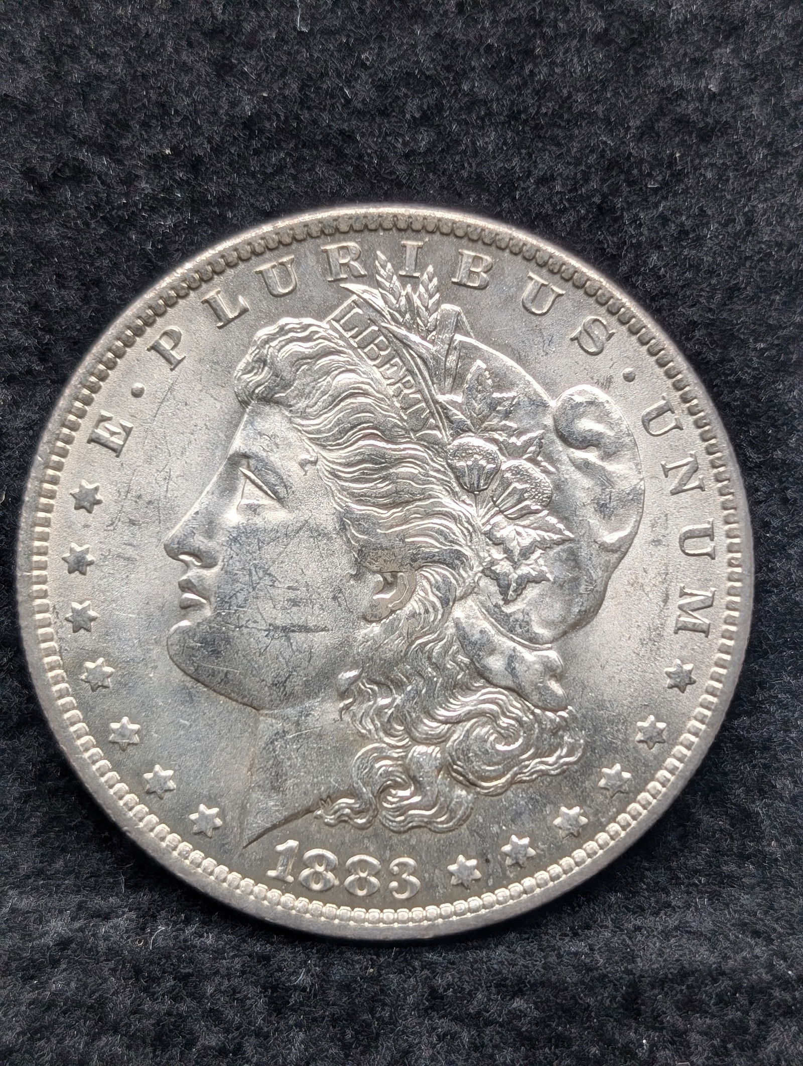 1883-O Morgan Dollar. Very Choice BU with great luster. Original. (1 of 3)