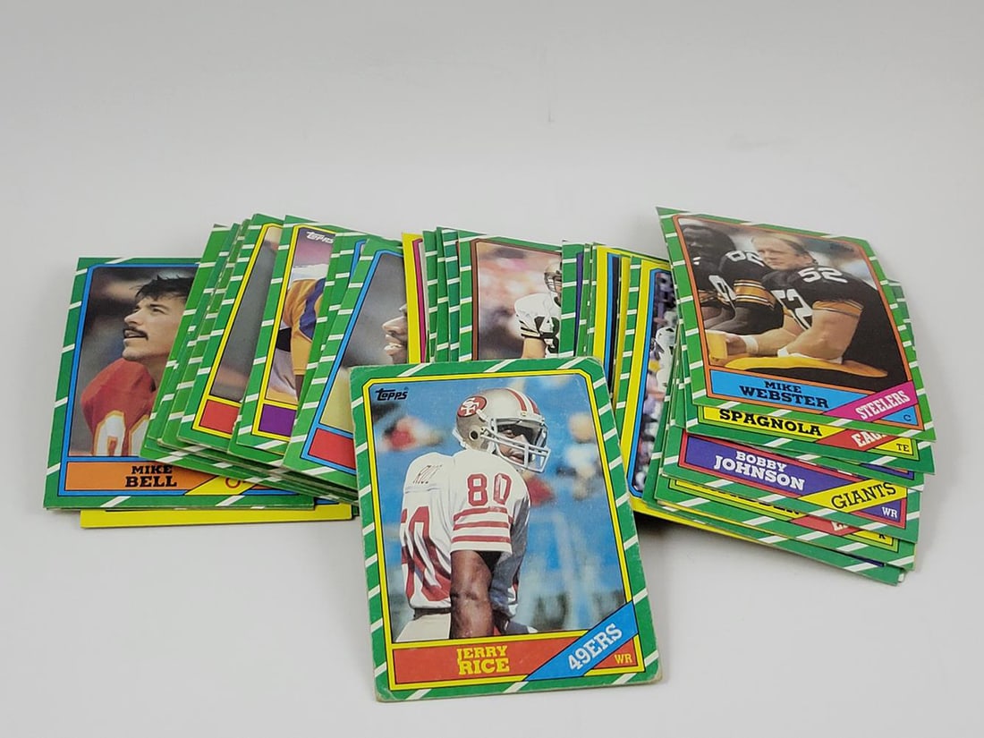 1986 Topps Football Lot of (60) - Jerry Rice RC: 1986 Topps Football Lot of (60) - Includes Jerry Rice Rookie - Varying Conditions
