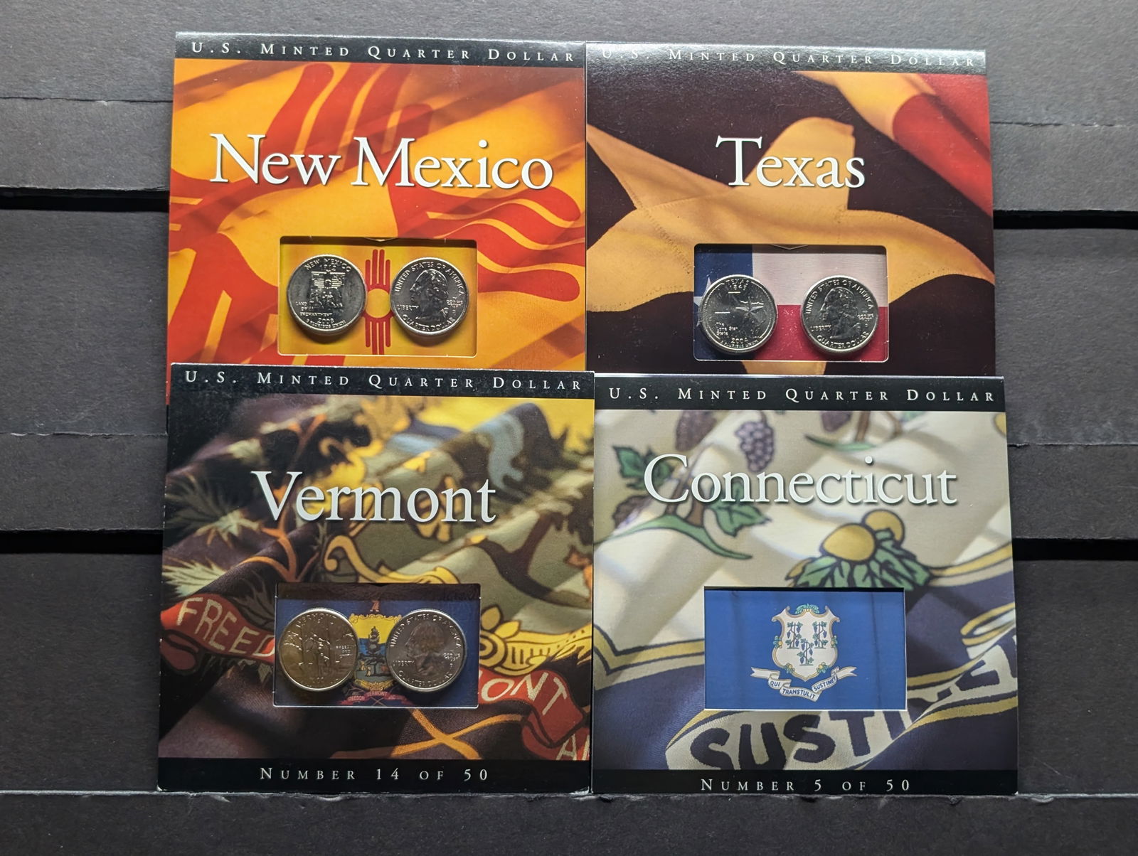 Lot of Four P&D Mint Statehood Quarters in State Information Displays (1 of 14)