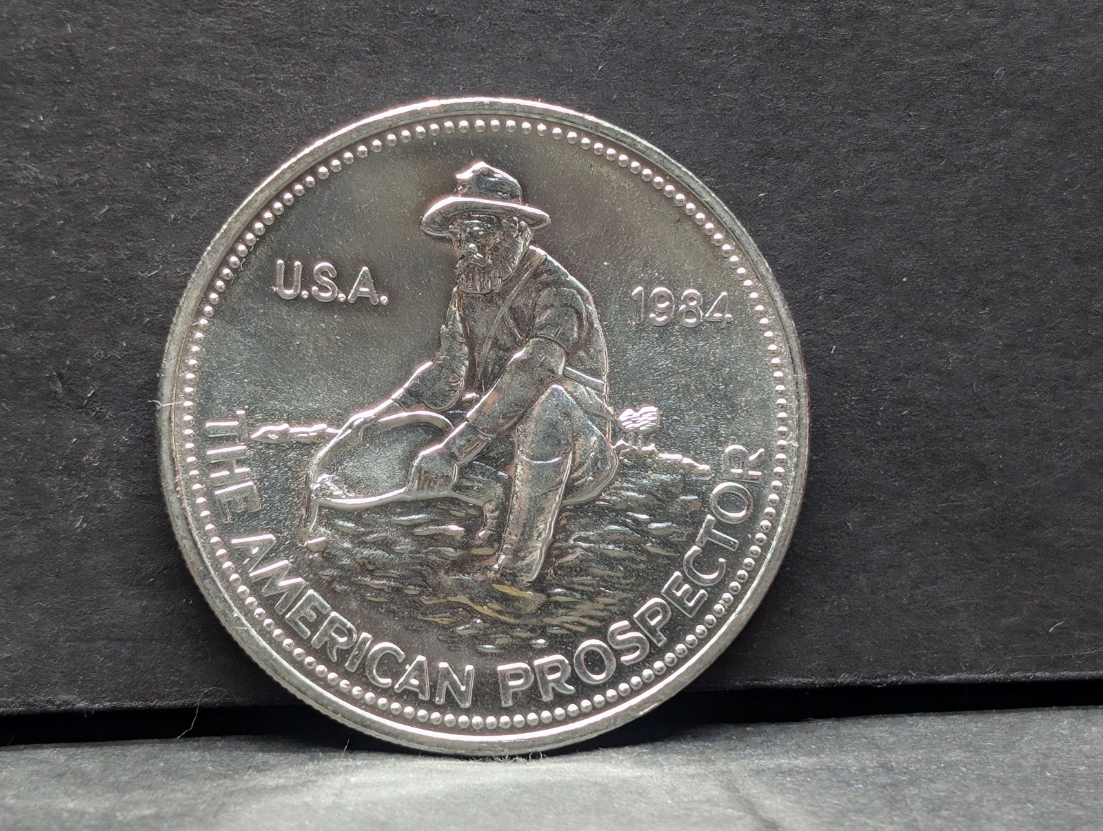 1 Troy Oz. .999+ FINE SILVER 1984 American Prospector Designed Round: 1 Troy Oz. .999+ FINE SILVER 1984 American Prospector Designed Round