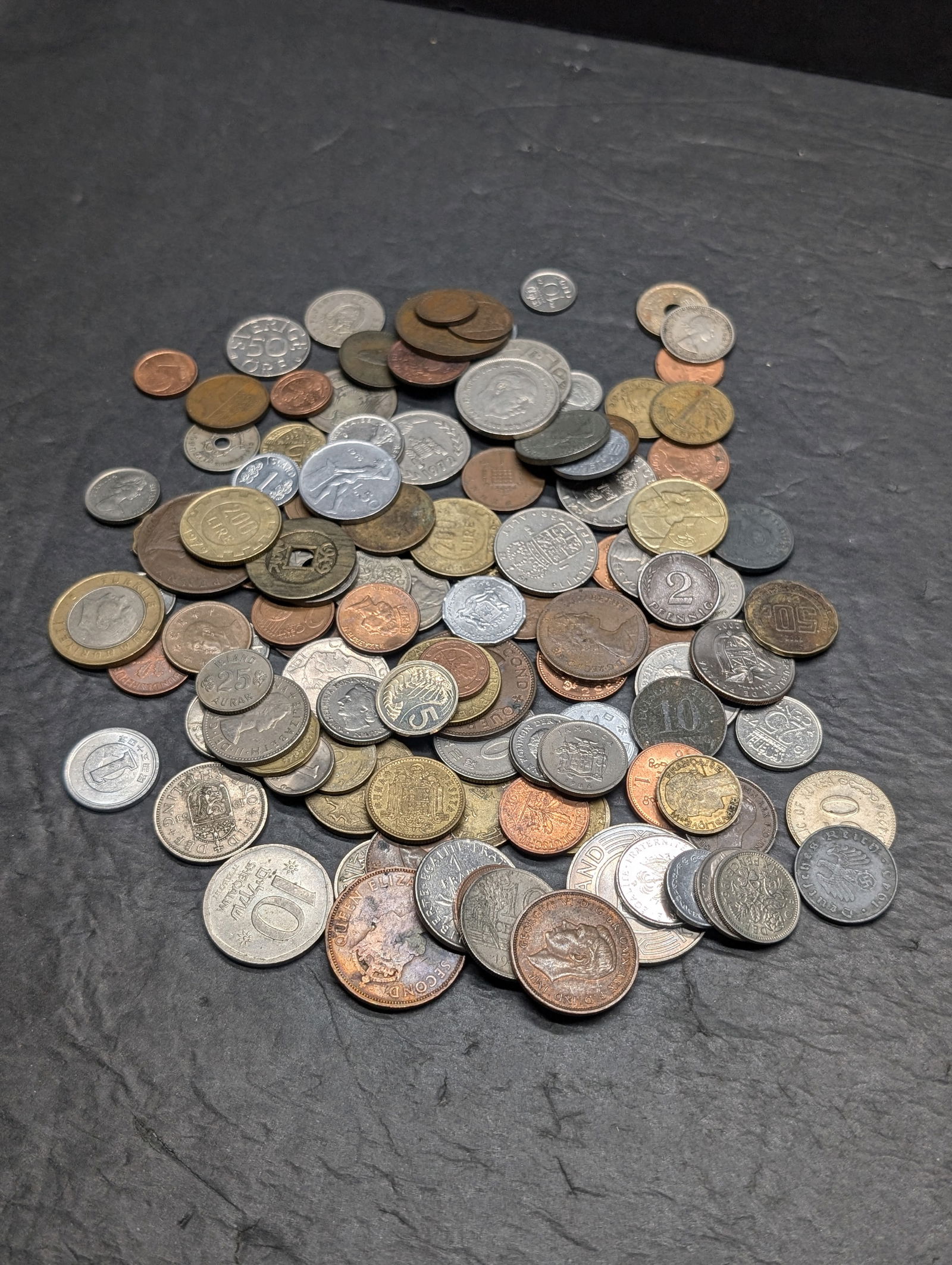 One pound plus foreign coins. Nice mix. (1 of 4)