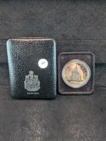 1976 Canadian 50% Silver Dollar, Obverse: Young bust right, Reverse: Library building, Designer: