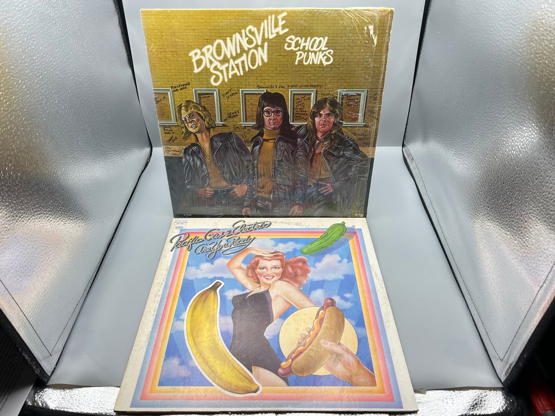 Two (2) LP Blues Rock Lot - Brownsville Station: School Punks (1974), in original shrinkwrap; and: Two (2) LP Blues Rock Lot - Brownsville Station: School Punks (1974), in original shrinkwrap; and Pacific Gas & Electric: Are You Ready (1970) - Records have not been tested by the auction house for p