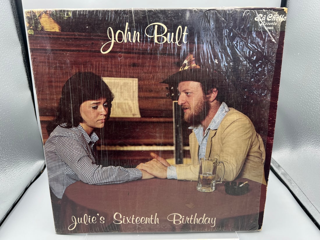 John Bult: Julie's Sixteenth Birthday (1985), slight tear in original shrinkwrap, highly sought -: John Bult: Julie's Sixteenth Birthday (1985), slight tear in original shrinkwrap, highly sought - top of most Worst Album Cover Lists 2011 Ellen Degeneres spotlighted it on Bad Album cover segment) - 