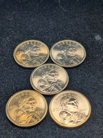 Five 2000-P UNC Sacagawea Dollars.
