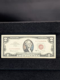 1963A Red Seal 2 Dollar Bill in nice shape with good corners in protective sleeve.