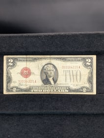 1928E Red Seal 2 Dollar Bill with nice full corners in protective sleeve.
