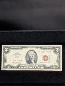 1963 Red Seal 2 Dollar Bill with good corners and no marks.