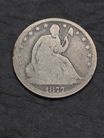 **AVERAGE CIRC** 1877 w/ Motto Seated Liberty Half Dollar