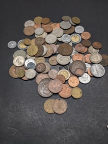 One pound plus foreign coins. Nice mix.?
