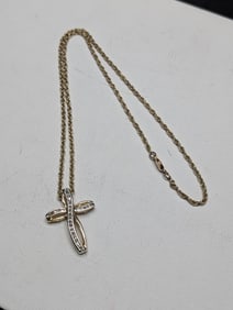 20 inch sterling, Gold Plated chain with stylized cross pendant. Pendant has crystals.?