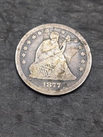1877-CC w/ Motto Seated Liberty Quarter