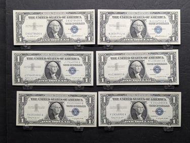 Six 1957 $1 silver certificates.: two 1957, two 1957 A, and two 1957 B. All choice crisp