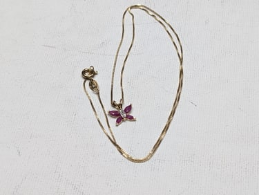 18 Inch sterling chain with small butter fly pendant. Gold overlay. Appears never worn.?