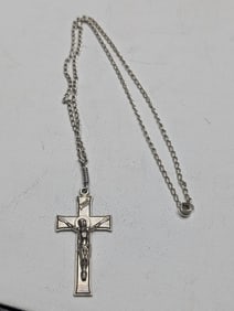 15 inch sterling silver cable chain with one and one half inch crucifix. Crucifix not sterling.?