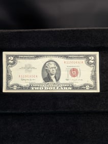 1963 Red Seal 2 Dollar Bill. No tears or writing and good corners.