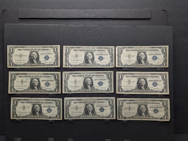 Nine One Dollar Blue Seal Silver Certificates- (2) 1935E, (1) 1935E, (1) 1935G, (2) 1957, (1) 1957A,