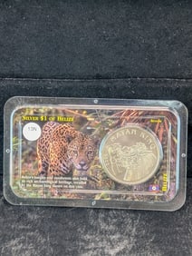 2002 Uncirculated Belize .925 Silver Dollar, Weighs 31.06 Grams. OBV: Nat'l Coat Of Arms. REV: