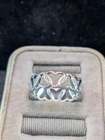 Woman's Sterling Silver Hearts Linked Design Size 7 1/2 Ring. Marked 925. Ring Weighs 0.09 Toz