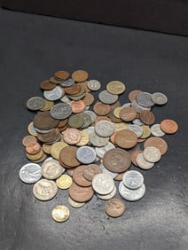 One pound plus mix of foreign coins.