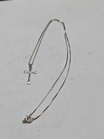 18 inch light sterling chain with cross. Great shape.