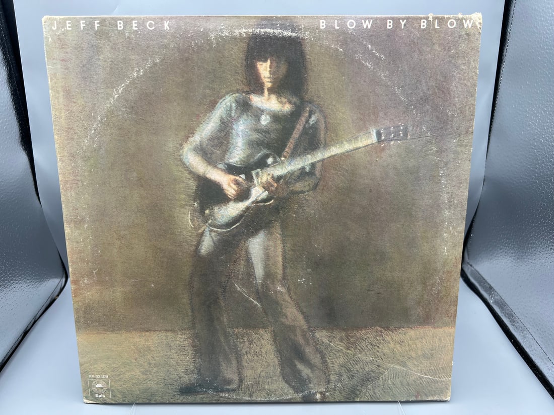 1975 Jeff Beck Blow By Blow Vinyl Album - PE 33409: 1975 Jeff Beck Blow By Blow Vinyl Album - PE 33409 - Records have not been tested by the auction house for play quality. All items are sold as is.