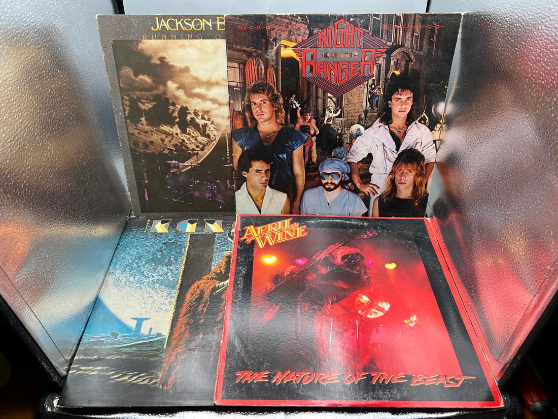 Lot of (4) Assorted Vinyl Albums - Jackson Browne, Night Ranger, Kansas, April Wine: Lot of (4) Assorted Vinyl Albums - Jackson Browne, Night Ranger, Kansas, April Wine - Records have not been tested by the auction house for play quality. All items are sold as is.