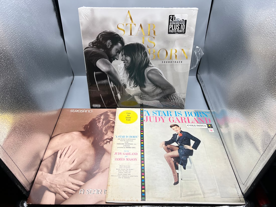 A Star is Born (3 LP Lot): SEALED - Lady Gaga & Bradley Cooper soundtrack (2018), shrinkwrap is torn: A Star is Born (3 LP Lot): SEALED - Lady Gaga & Bradley Cooper soundtrack (2018), shrinkwrap is torn but still tightly sealed; Barbara Streisand & Kris Kristofferson soundtrack (1976), unsealed; and J