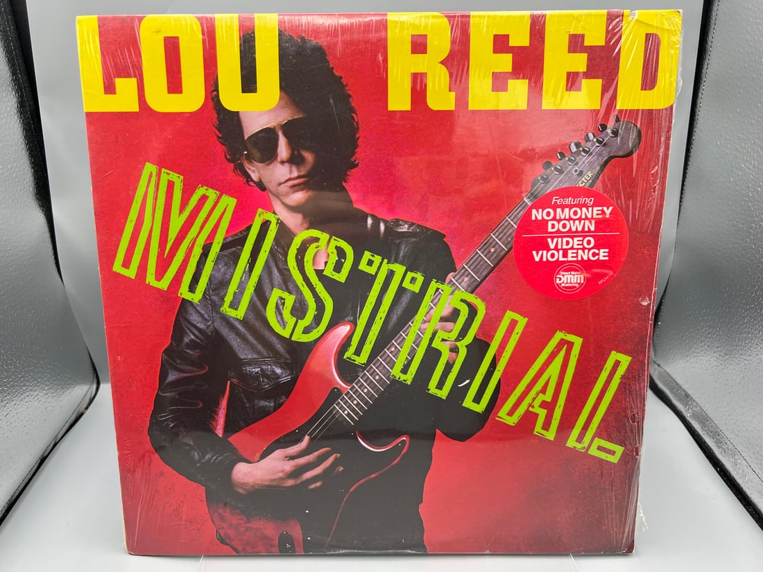 SEALED - Lou Reed: Mistrial (1986), promo notch in cover: SEALED - Lou Reed: Mistrial (1986), promo notch in cover - Records have not been tested by the auction house for play quality. All items are sold as is.