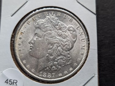 1887 Morgan Silver Dollar. MS. 90% Silver