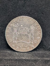 1736 Mexico 8 Reale Pillar Dollar. This one?s been to China-chop marks. Chinese merchant guaranteed