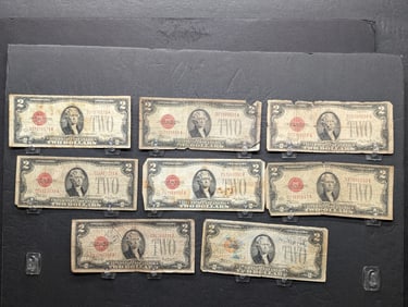 Eight 1928 D US Red Seal $2 Notes. Circulated.