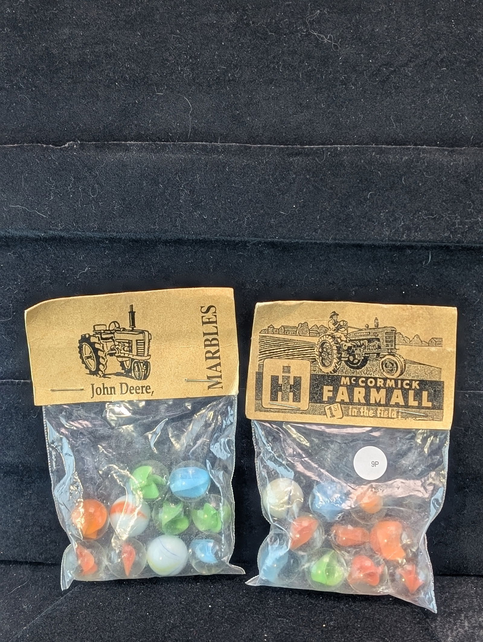 John Deere and Farmall McCormick Tractor's; Marbles in sealed Bags: John Deere and Farmall McCormick Tractor's; Marbles in sealed Bags