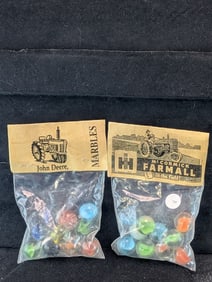John Deere and Farmall McCormick Tractor's; Marbles in sealed Bags