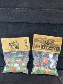 John Deere and Farmall McCormick Tractor's; Marbles in sealed Bags