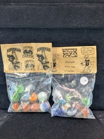 Superman and Popeyes;  Marble in sealed Bags