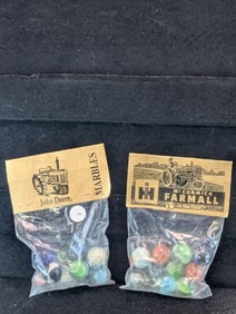 John Deere and Farmall McCormick Tractor's; Marbles in sealed Bags