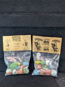Superman and Popeyes;  Marble in sealed Bags