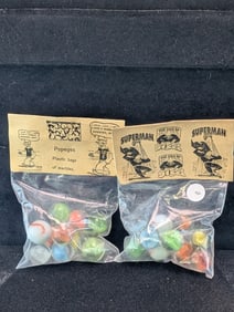 Superman and Popeyes;  Marble in sealed Bags